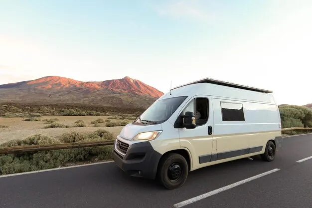 imageye___-_imgi_104_white-van-mountain-road-dusk-with-teide-volcano-background_549612-2357